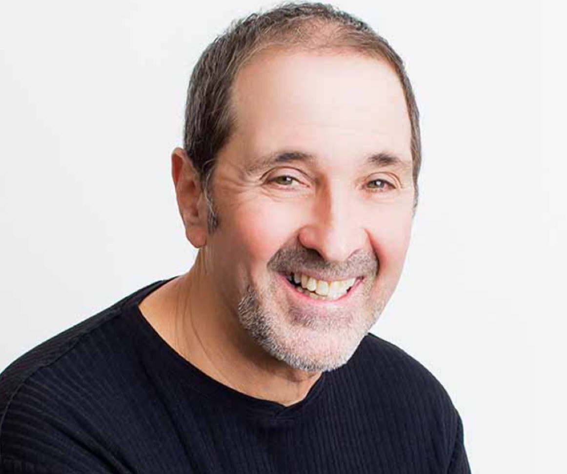 Dr. Bill Polonsky who is wearing a black shirt and is smiling.